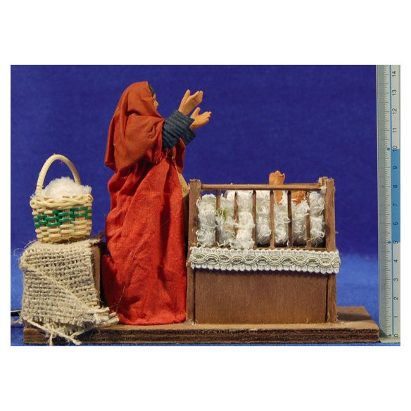 Woman raise children from a cradel movement 12 cm clay and clothes
