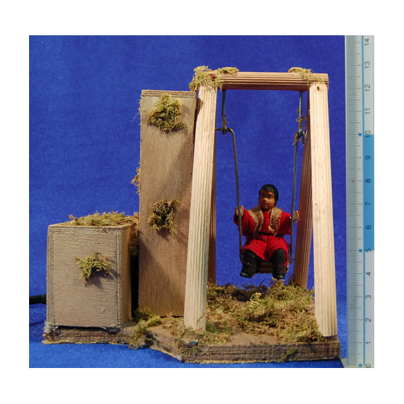 Niño con columpio movimiento 12 cm barro pintado