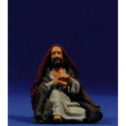 Shepherd seating on the floor 10 cm clay and clothes