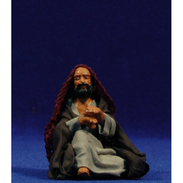 Shepherd seating on the floor 10 cm clay and clothes