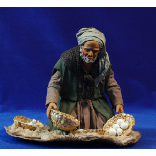 Uomo in ginocchio con cestini uova 25 cm stoffe e terracotta